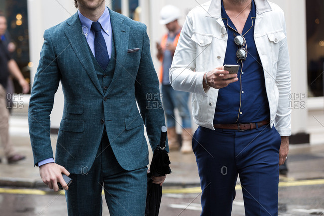 Two men walking down the street during London Fashion Week