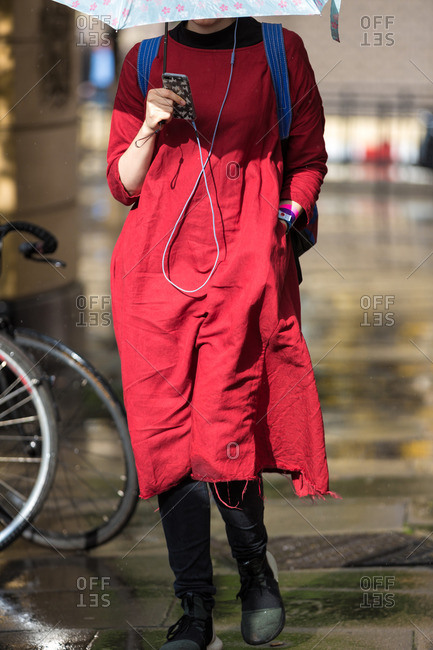Person walking in the rain during London Fashion Week