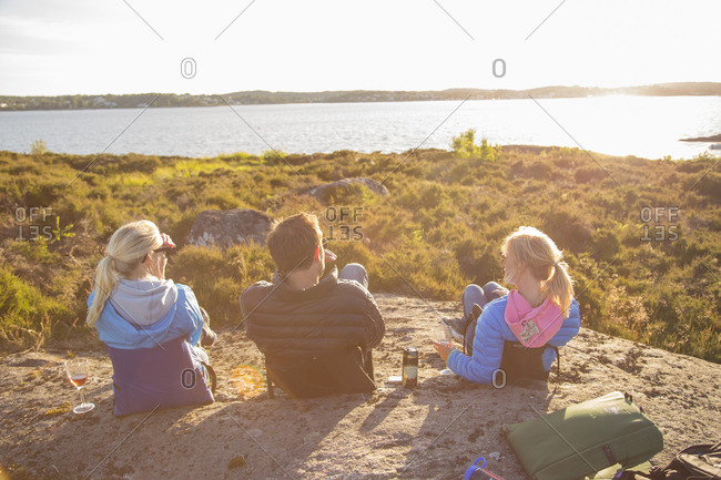 Sweden, Swedish West Coast, Holland, Kungsbackafjorden, Women and man resting by bay