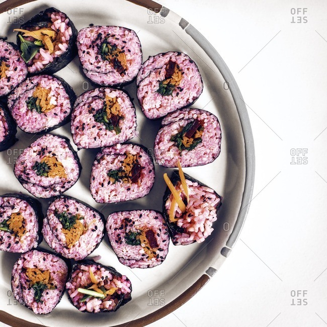 Overhead view of sushi served in plate on table