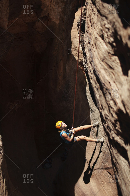 High angle view of woman climbing mountain