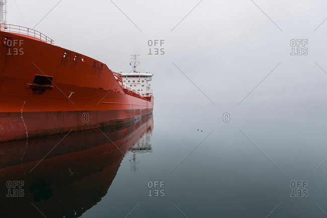 Red ship on empty lake