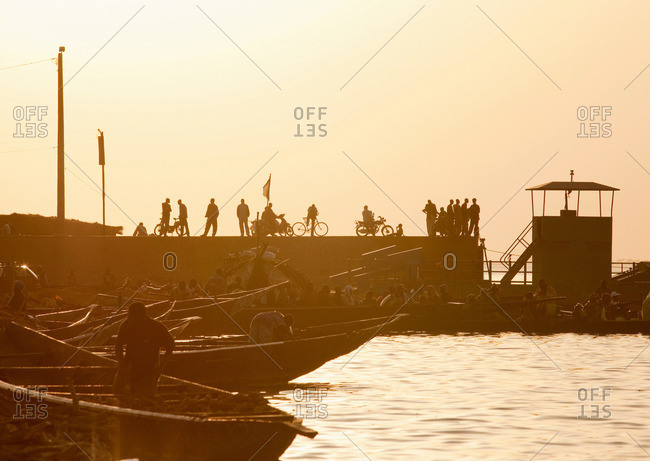 A crowded dock on the Niger River early in the morning at Segou, Mali