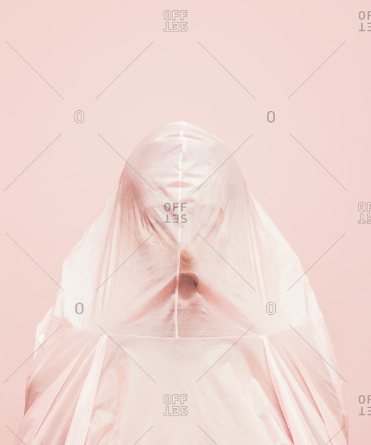 Person covered in a pink cloth