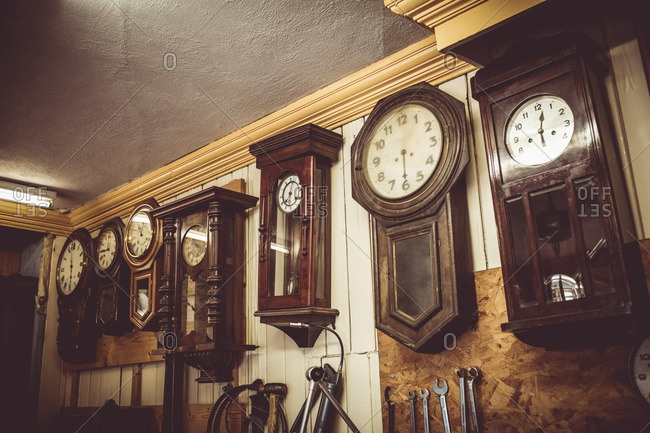 Clocks for repair hanging on the wall