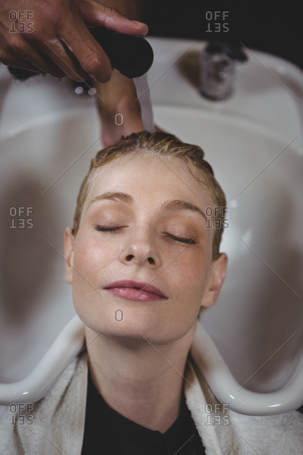 Woman getting her hair wash at a salon