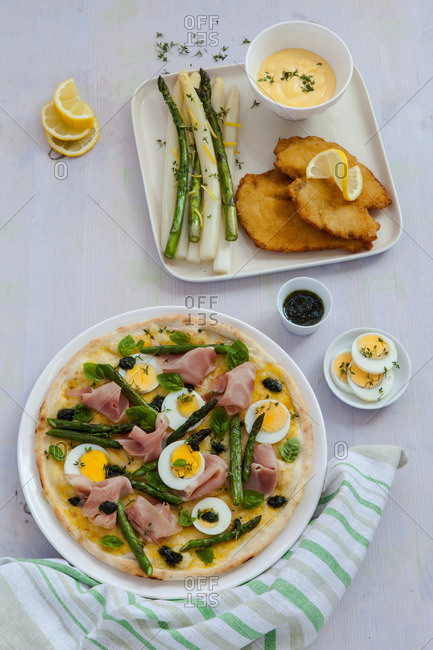 Asparagus, ham and egg pizza and side dish