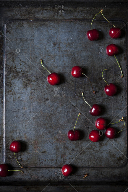Fresh red cherries on dark rusty background