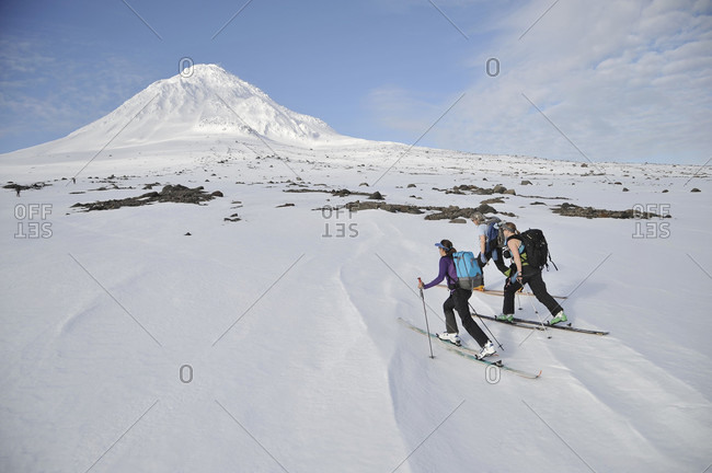 Skiers ascend the Northeast flanks of  Mt Augustine