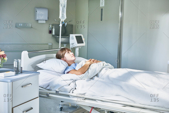 Woman laying down in hospital bed