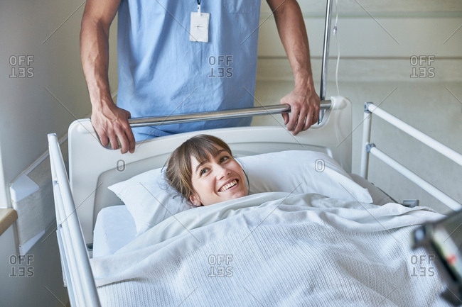 Patient in hospital bed smiling