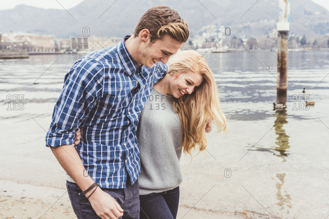 Young couple strolling on lakeside, Lake Como, Italy