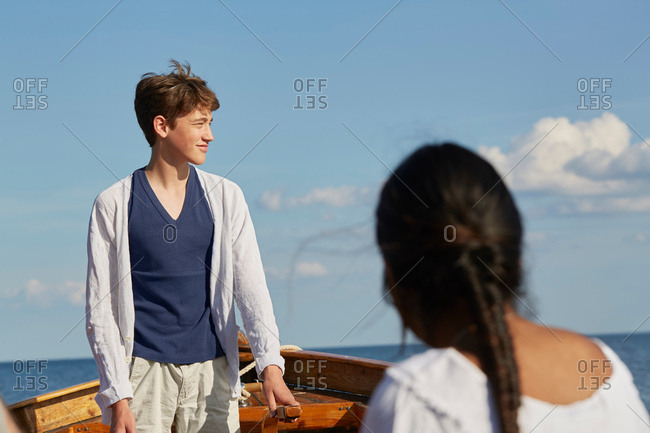 Young people on boat looking away