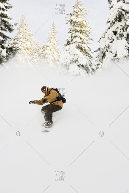 A man snowboarding