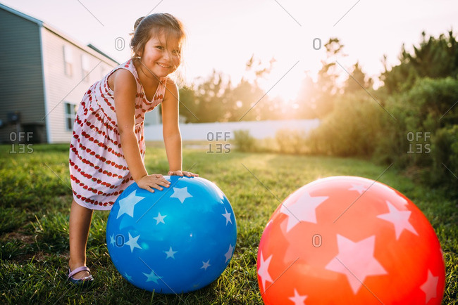 Girl smiling with bouncy balls
