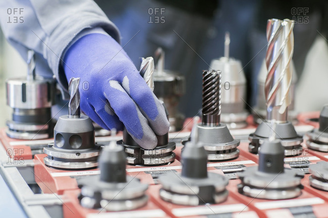 Engineer hand operating at drill bit in an industrial plant, Freiburg im Breisgau, Baden-Wurttemberg, Germany