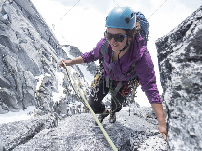 A Woman Climbing Middle Troll In Little Switzerland In Denali National Park