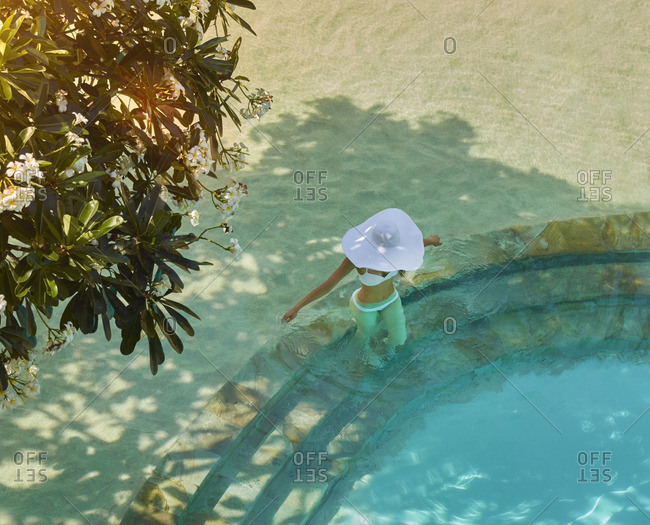 High angle view of Pacific Islander woman in swimming pool