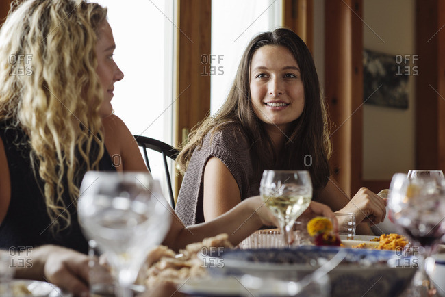 Two women talking during Thanksgiving dinner
