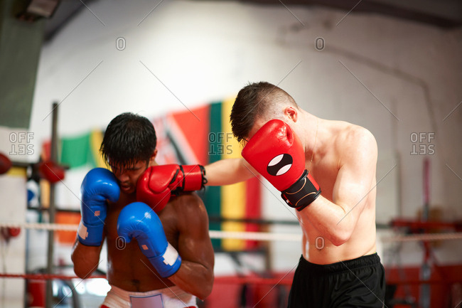 Two boxers sparring in boxing ring