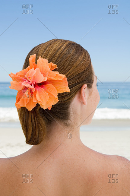 Young woman with flower in her hair