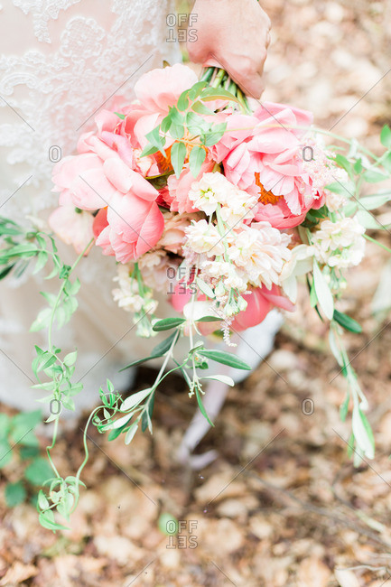 Bride holding pink flowers