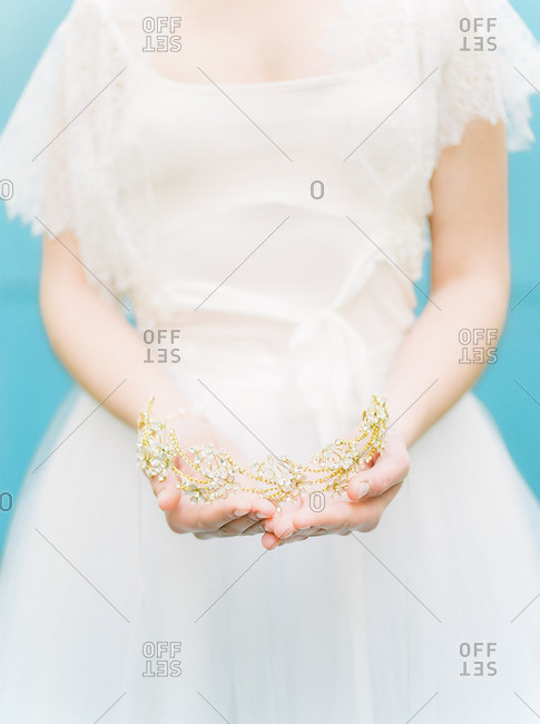 Bride holding a tiara in hands