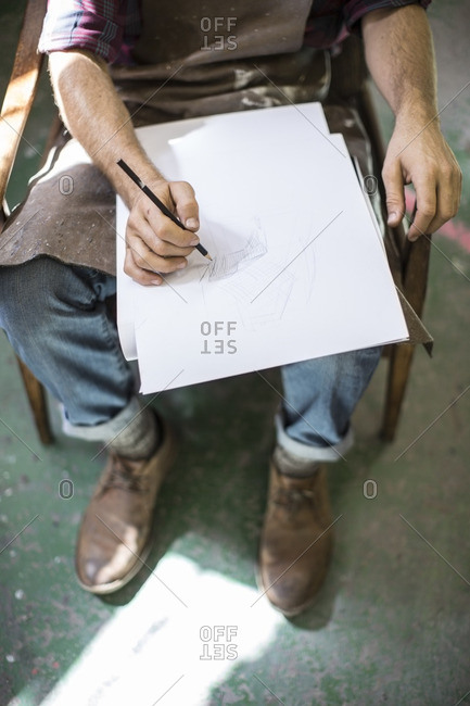 Man drawing in sketch book