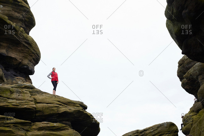 Woman standing on rock formations