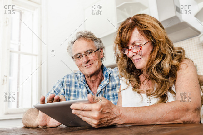 Older couple using tablet computer