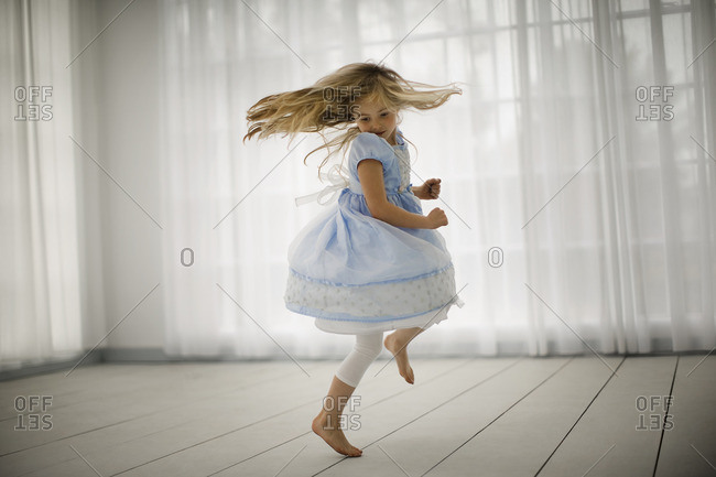 Young girl dancing in circles.