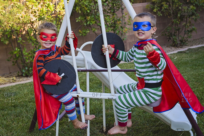 Two boys in superhero costumes