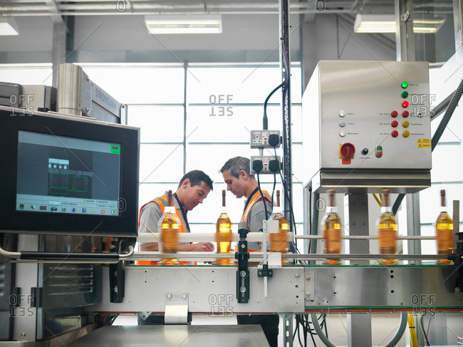 Factory workers in bottling plant