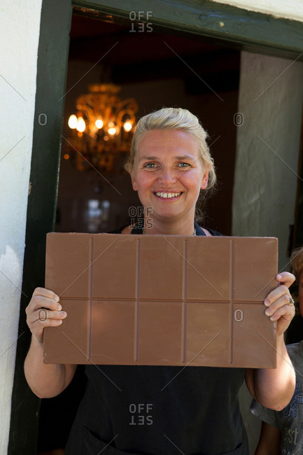 Woman showing chocolate bar