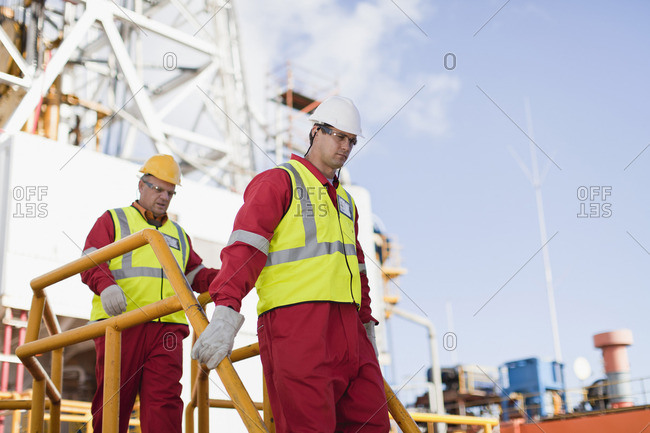 Workers walking on oil rig