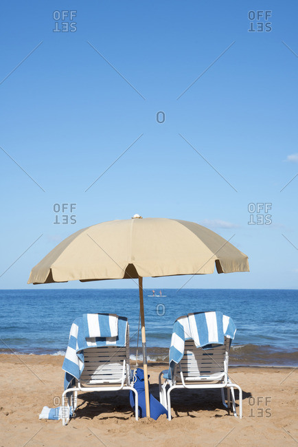 Beach chairs and umbrella along the beach in Wailea, Maui, Hawaii
