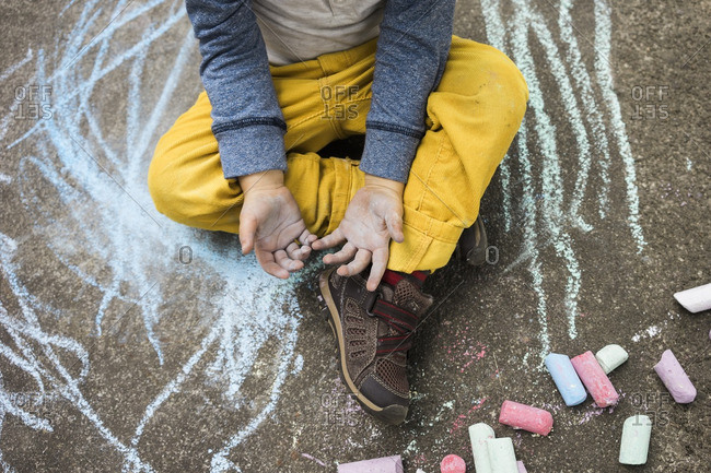 Boy with chalk covered hands