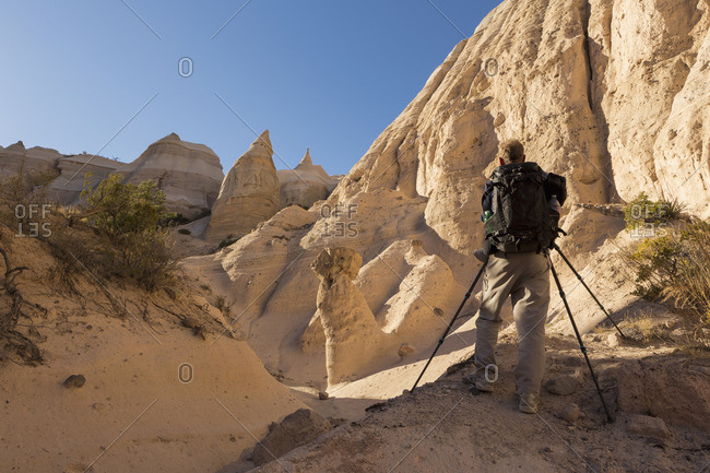 Man taking pictures of tent rocks at Kasha-Katuwe Tent Rocks National Monument