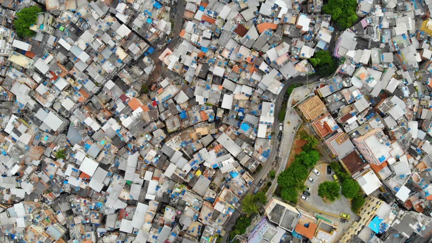 Favela Aerial Downwards Tilt From Mountain Setting To Favela Houses In