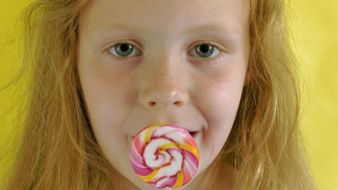 Little Girl Sucks Lollipop