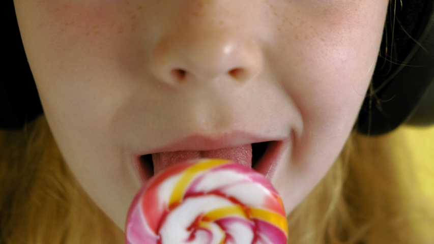 Little Girl Sucks Lollipop