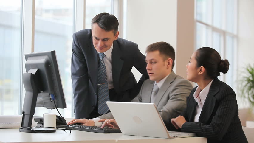 Boss checks the work of colleagues 