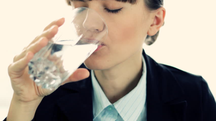 Commercial, montage of young businesswoman having headache and drinking glass of water with effervescent tablet