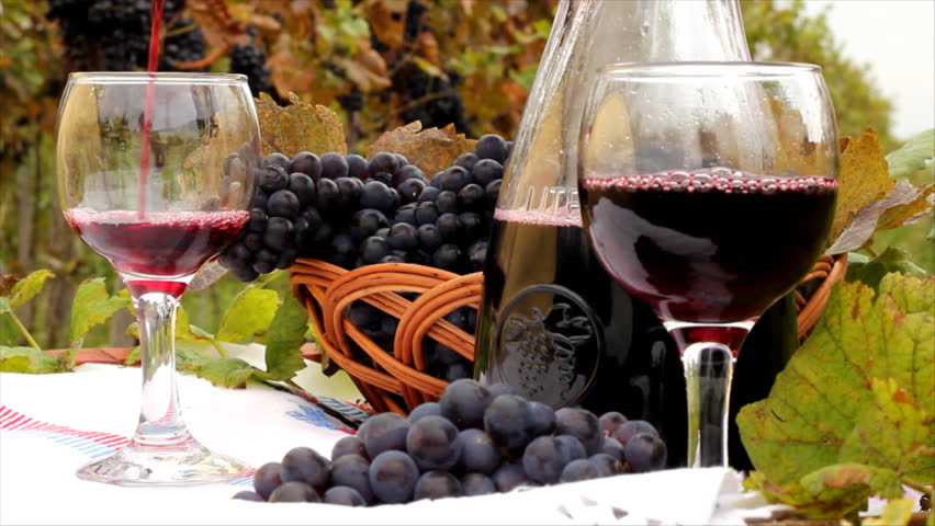 Pouring red wine into a glass