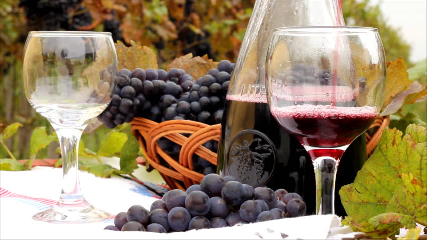 Pouring red wine into a glass