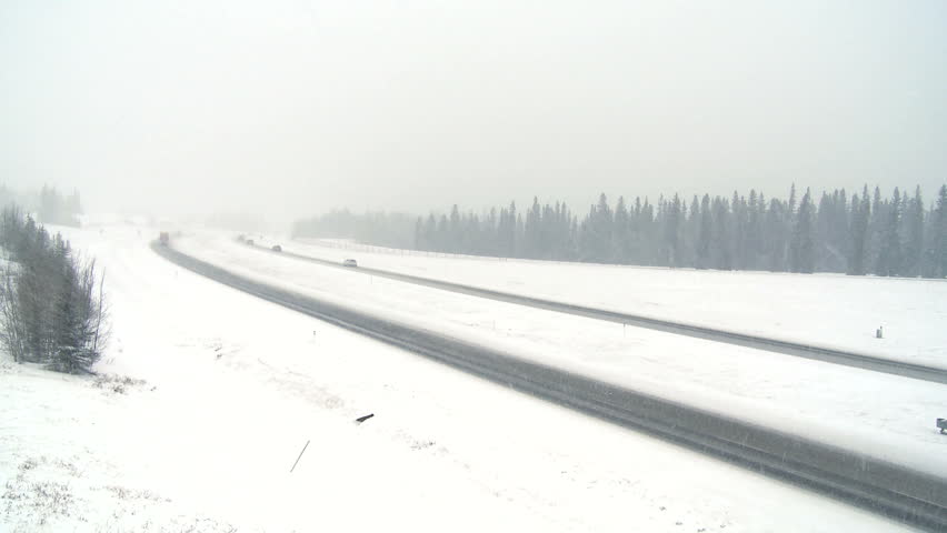 Highway truck traffic during blizzard