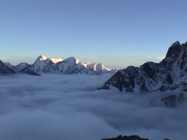 2 views of the cloud covered Gokyo Valley from Gokyo Ri, Nepal