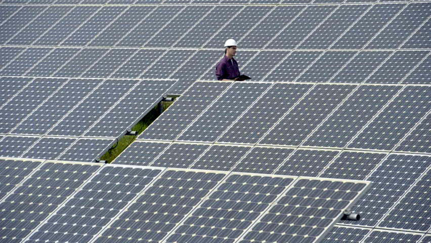 Contractors/Electricians inspecting solar panels; Full HD Photo JPEG
