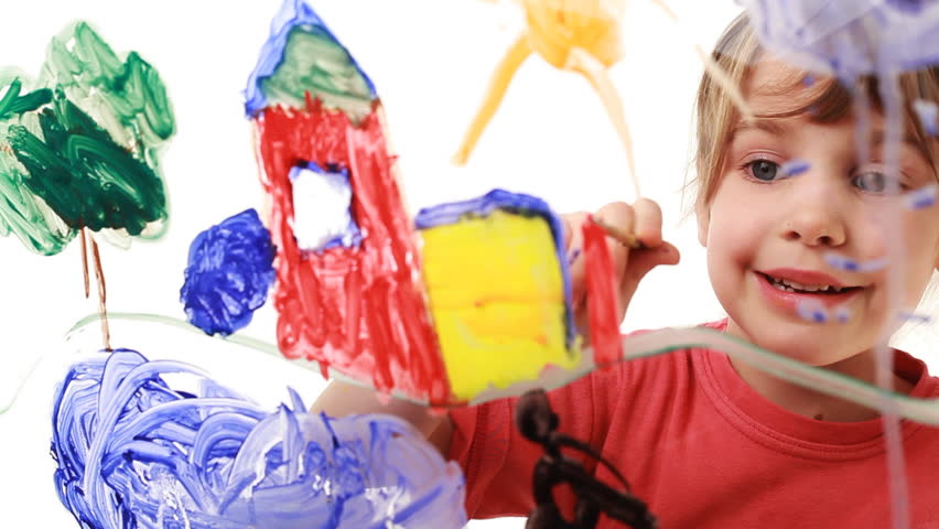 nice little girl paint himself at home in picture on transparent glass, behind white background