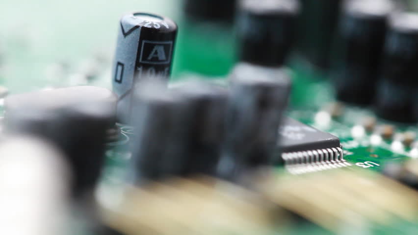 printed circuit board with radio components rotates clockwise, macro